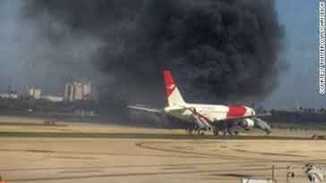 Plane catches fire on runway